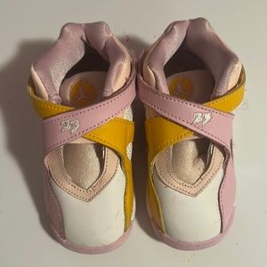 Baby Jordan’s pink,orange,and white